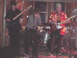 Love & War in Texas enjoys the Guitar, Harp, and Bass of the Blues Drifters.