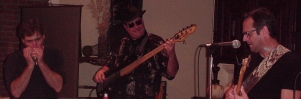 DrBlooz, TrainTime, and Scott (Gecko) Yarbrough power it up for the audience in McKinney.