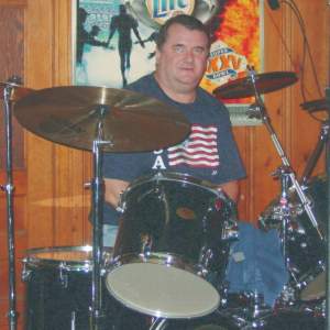 Mark Elloit posing with his drums for his picture at the Carter's Place show.